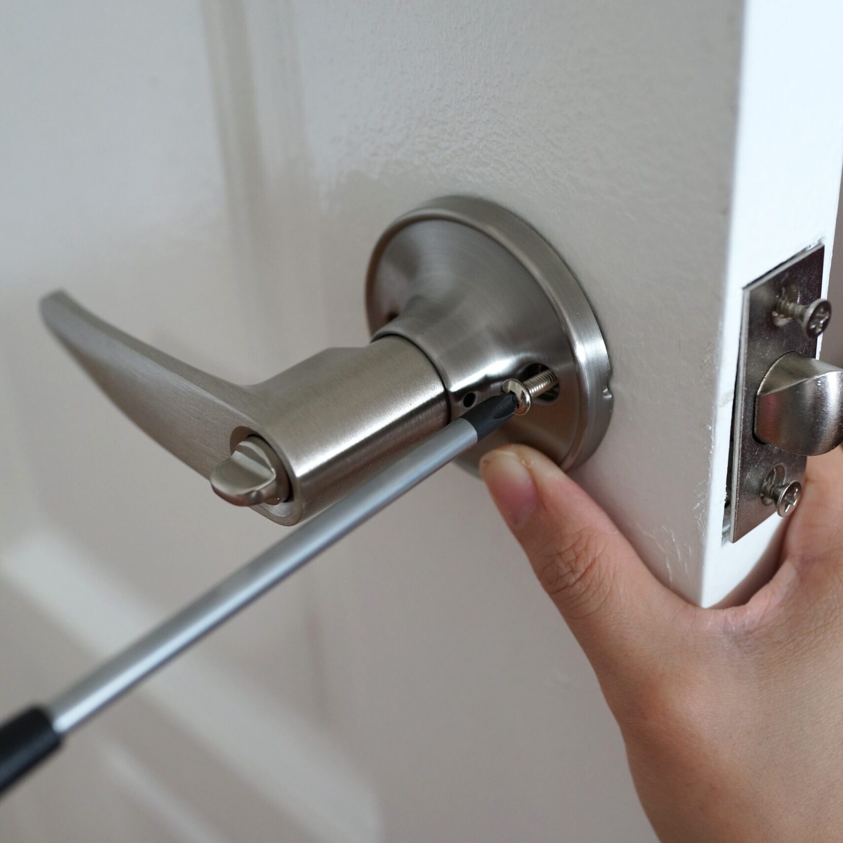 handyman-install-the-new-door-lock-in-new-house-2021-08-30-11-41-39-utc